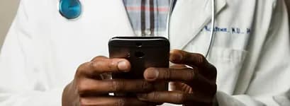 Clinician holding a phone