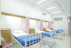 Empty hospital ward with beds