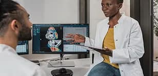 Clinician explaining a scan to a colleague